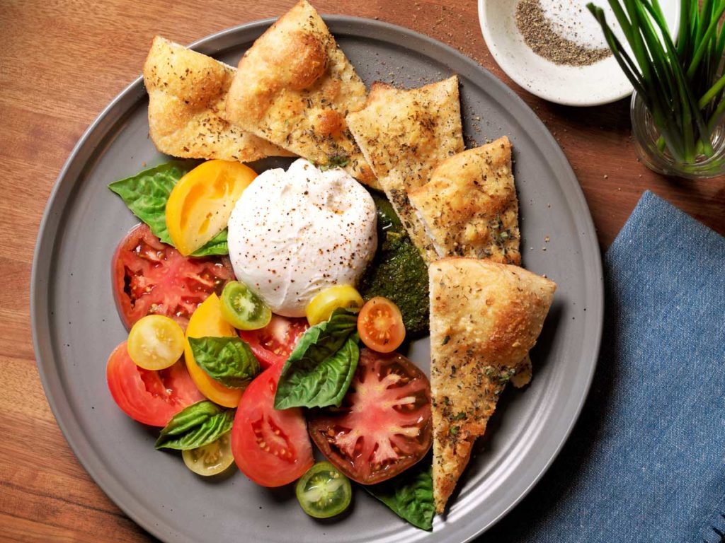 Burrata cheese with tomatoes and bread, at BALEENkitchen