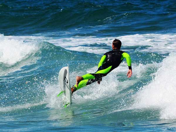Surfer riding the waves at Sunny Isles Beach
