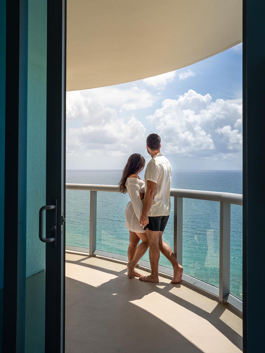 Couple Standing On The Balcony